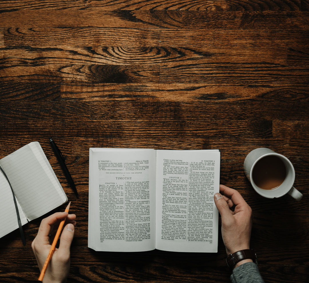 a man is reading his book on how to choose luxury vinyl flooring